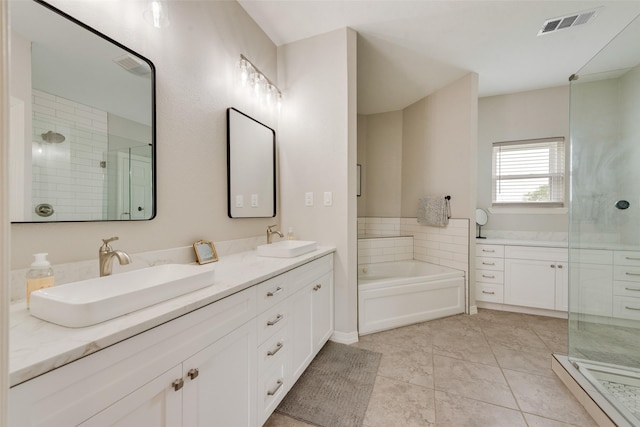 15393 Armstrong Rd, Terrell, TX 75160 - full bath with double vanity, a shower stall, and a garden tub