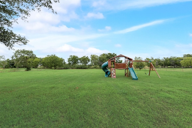 15393 Armstrong Rd, Terrell, TX 75160 - view of green lawn with a playground
