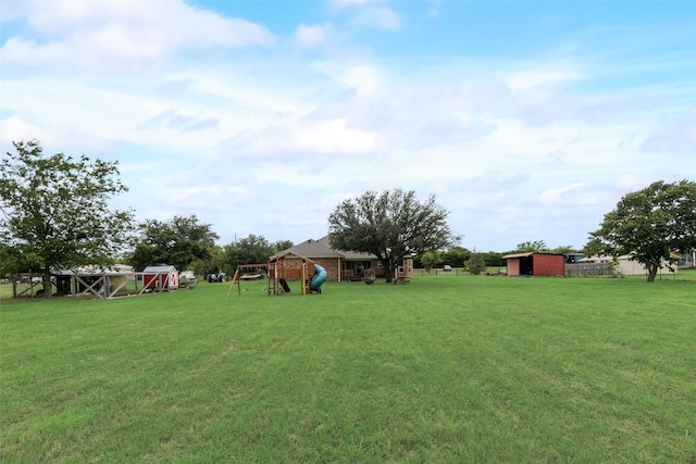 15393 Armstrong Rd, Terrell, TX 75160 - view of green lawn featuring a playground