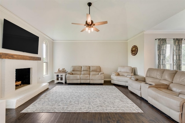 15393 Armstrong Rd, Terrell, TX 75160 - living area with healthy amount of natural light, a ceiling fan, a brick fireplace, lofted ceiling, and dark wood-style floors