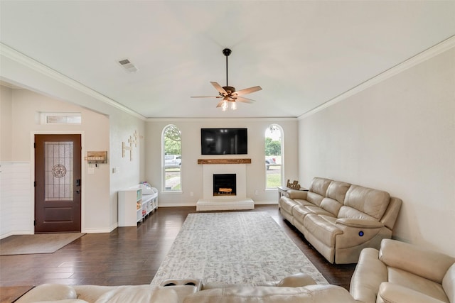 15393 Armstrong Rd, Terrell, TX 75160 - living room featuring dark wood finished floors, a ceiling fan, crown molding, a fireplace, and baseboards
