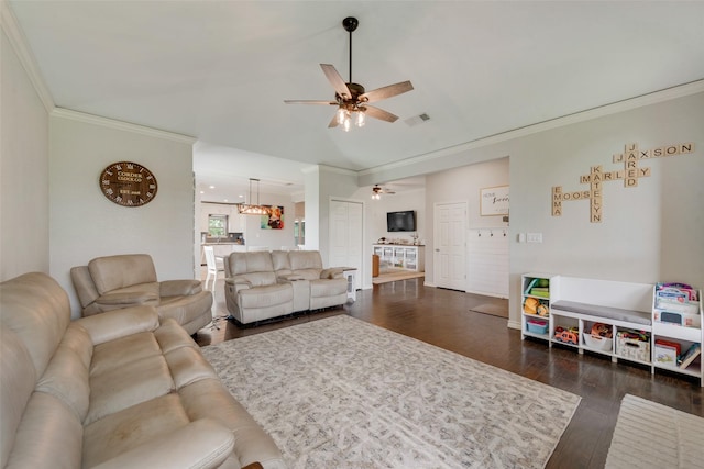 15393 Armstrong Rd, Terrell, TX 75160 - living room with a ceiling fan, crown molding, dark wood-style flooring, vaulted ceiling, and a chandelier