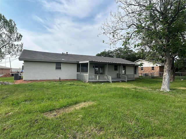 417 W Lyndale Ave, Robinson, TX 76706 - back of house featuring central air condition unit, brick siding, roof with shingles, and a porch