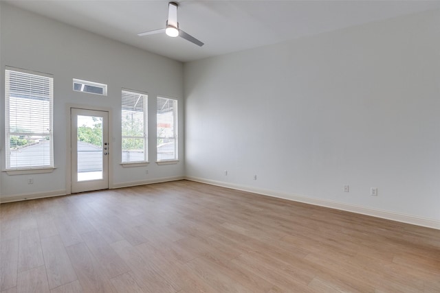 1811 S Ervay St, Dallas, TX 75215 - unfurnished room featuring ceiling fan, light wood-style flooring, and baseboards
