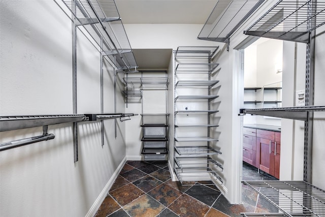 1811 S Ervay St, Dallas, TX 75215 - walk in closet featuring stone tile floors