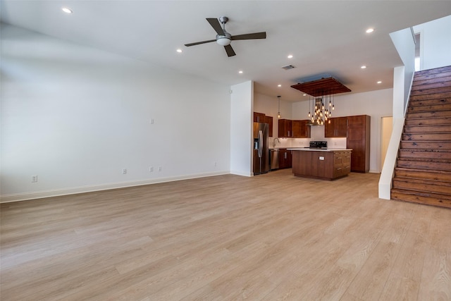 1811 S Ervay St, Dallas, TX 75215 - unfurnished living room featuring stairway, a ceiling fan, light wood-style floors, baseboards, and recessed lighting