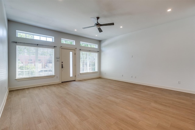 1811 S Ervay St, Dallas, TX 75215 - unfurnished living room featuring ceiling fan, light wood-style flooring, recessed lighting, and baseboards
