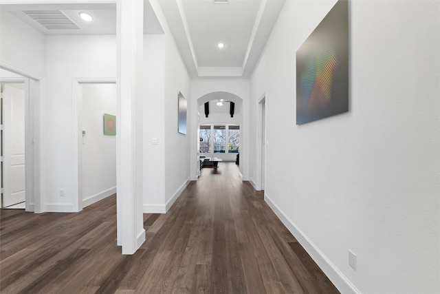 15140 Spider Lily Rd, Frisco, TX 75035 - corridor with arched walkways, dark wood finished floors, and baseboards