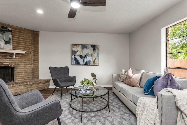 527 Cumberland Dr, Allen, TX 75002 - living area with wood finished floors, ceiling fan, baseboards, a fireplace, and recessed lighting