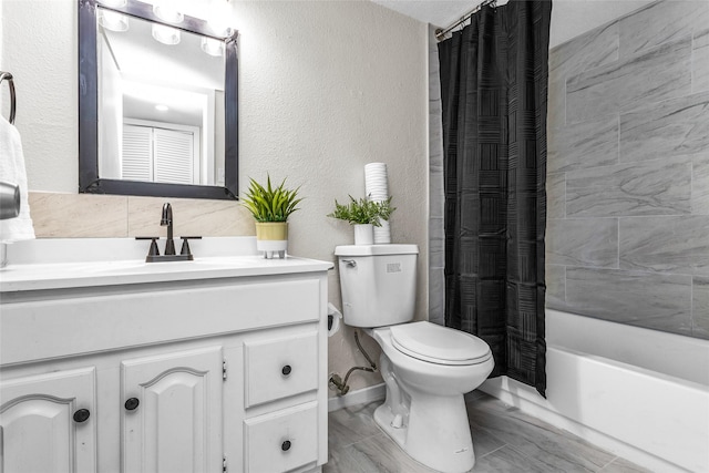 527 Cumberland Dr, Allen, TX 75002 - bathroom featuring vanity, toilet, shower / tub combo, and a textured wall