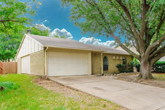 527 Cumberland Dr, Allen, TX 75002 - view of front facade with brick siding, concrete driveway, a garage, a shingled roof, and board and batten siding
