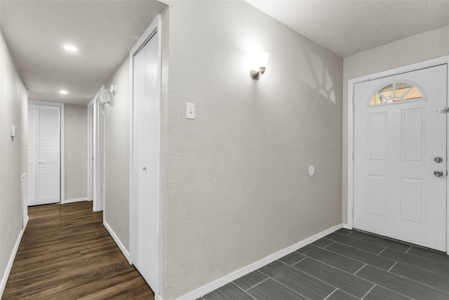 527 Cumberland Dr, Allen, TX 75002 - foyer entrance featuring baseboards, dark wood-style flooring, a textured wall, and recessed lighting