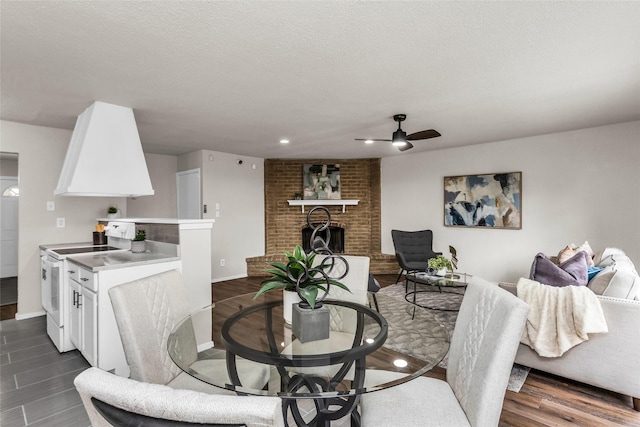 527 Cumberland Dr, Allen, TX 75002 - dining room with a ceiling fan, a fireplace, baseboards, dark wood-type flooring, and recessed lighting