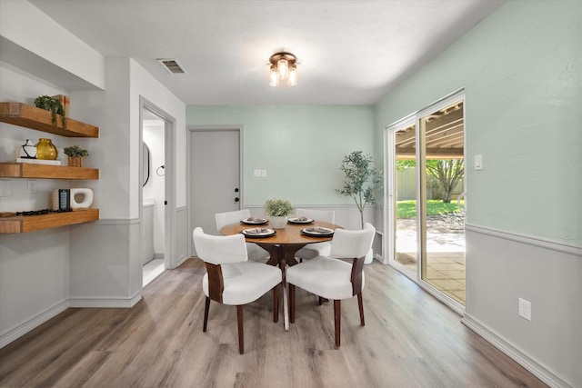 626 Pebblecreek Dr, Garland, TX 75040 - dining area with wood finished floors and baseboards