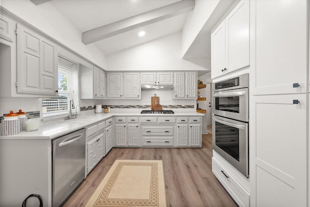 626 Pebblecreek Dr, Garland, TX 75040 - kitchen with stainless steel appliances, a sink, decorative backsplash, light wood-style floors, and recessed lighting