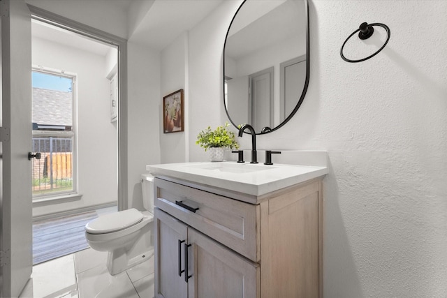 626 Pebblecreek Dr, Garland, TX 75040 - bathroom with vanity, toilet, tile patterned flooring, and a textured wall