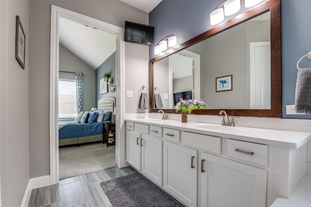 1340 Benavites Dr, Little Elm, TX 75068 - bathroom with connected bathroom, double vanity, and vaulted ceiling