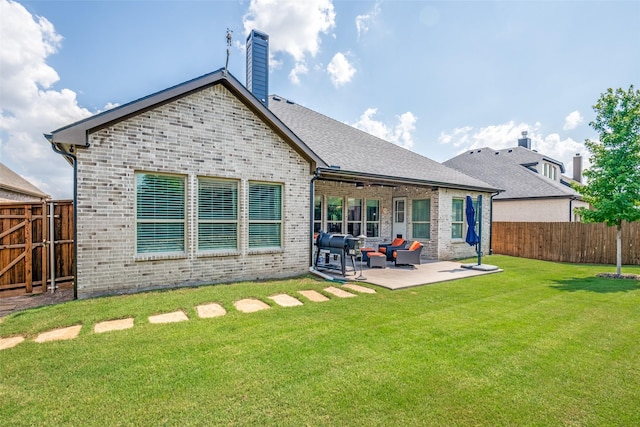 1340 Benavites Dr, Little Elm, TX 75068 - back of property featuring brick siding, a patio, outdoor lounge area, and a chimney