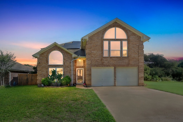 7413 Dana Ln, North Richland Hills, TX 76182 - traditional-style home featuring solar panels, concrete driveway, an attached garage, and brick siding