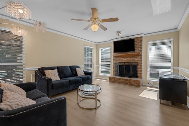 7413 Dana Ln, North Richland Hills, TX 76182 - living room with ornamental molding, wood finished floors, healthy amount of natural light, a fireplace, and ceiling fan