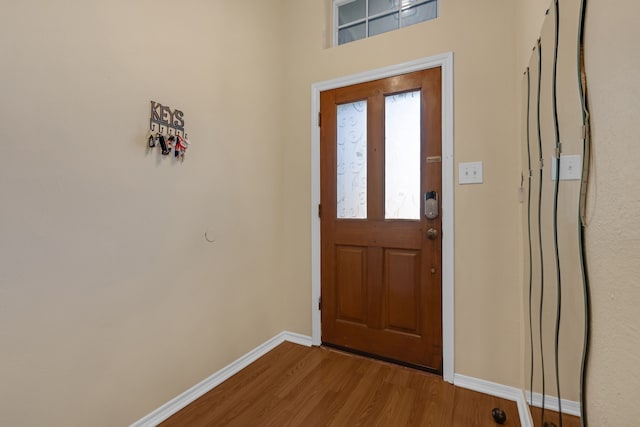 7413 Dana Ln, North Richland Hills, TX 76182 - entryway with baseboards and wood finished floors