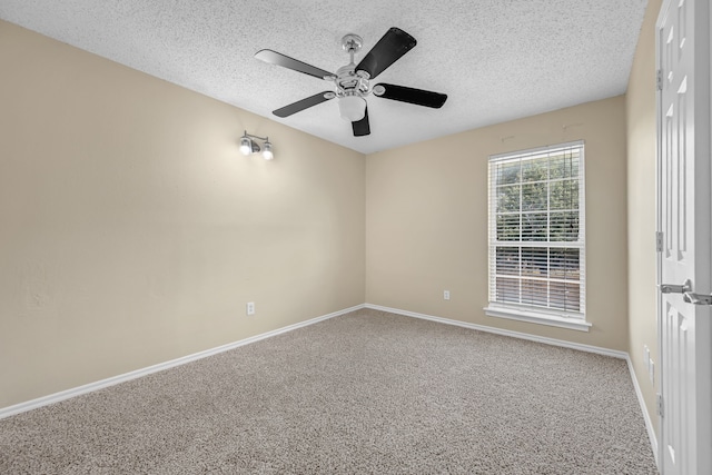 7413 Dana Ln, North Richland Hills, TX 76182 - carpeted empty room featuring a textured ceiling, a ceiling fan, and baseboards