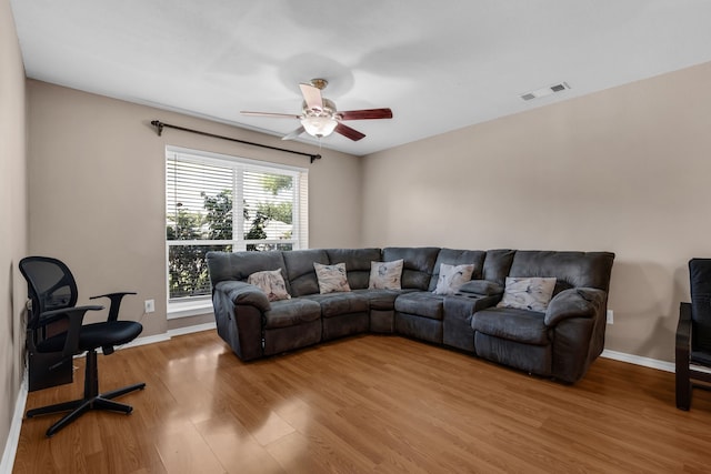 7413 Dana Ln, North Richland Hills, TX 76182 - living room featuring light wood-style flooring, a ceiling fan, and baseboards