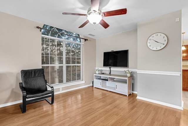 7413 Dana Ln, North Richland Hills, TX 76182 - living area with ceiling fan, light wood finished floors, and baseboards