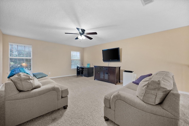 4207 Timber Trail Ct, Arlington, TX 76016 - living area with light colored carpet, a ceiling fan, baseboards, and a textured ceiling