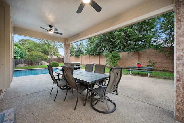 4207 Timber Trail Ct, Arlington, TX 76016 - fenced backyard featuring ceiling fan, outdoor dining area, and a patio