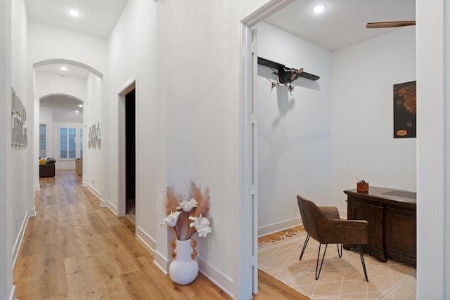4124 Sandbrock Pkwy, Aubrey, TX 76227 - corridor with arched walkways, light wood finished floors, recessed lighting, and baseboards