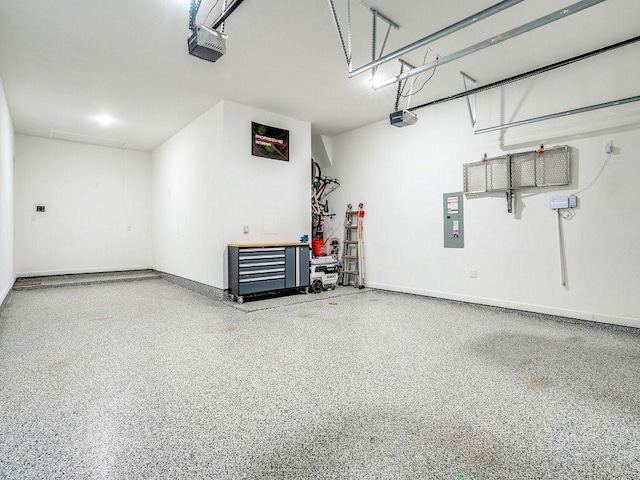 4124 Sandbrock Pkwy, Aubrey, TX 76227 - garage featuring a garage door opener, electric panel, and baseboards