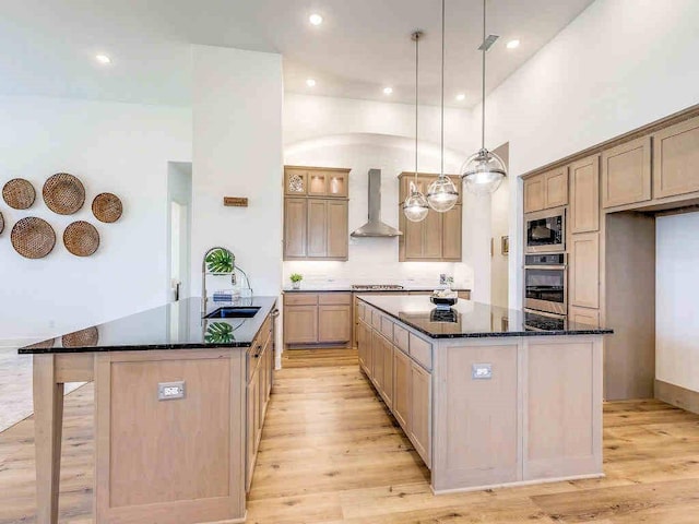 4124 Sandbrock Pkwy, Aubrey, TX 76227 - kitchen featuring a large island, wall chimney range hood, stainless steel appliances, a sink, and recessed lighting