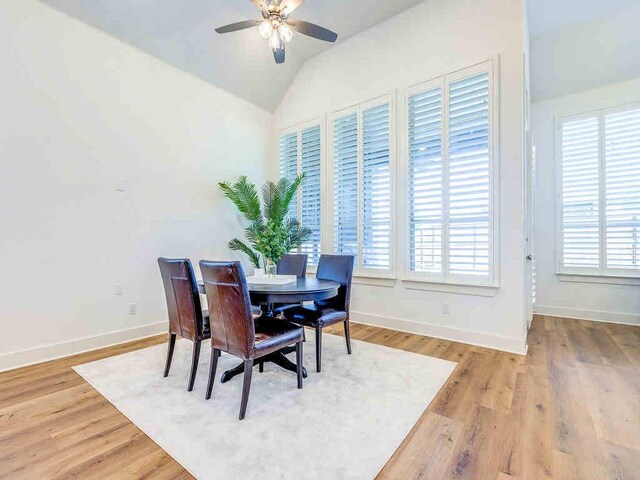 4124 Sandbrock Pkwy, Aubrey, TX 76227 - dining room featuring healthy amount of natural light, ceiling fan, vaulted ceiling, baseboards, and light wood-style floors