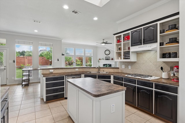 10237 Red Bluff Ln, Fort Worth, TX 76177 - kitchen featuring open shelves, white gas stovetop, crown molding, under cabinet range hood, and dark countertops