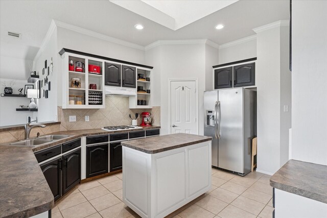 10237 Red Bluff Ln, Fort Worth, TX 76177 - kitchen featuring stainless steel fridge, a sink, dark countertops, ornamental molding, and a center island
