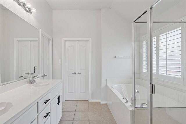 10237 Red Bluff Ln, Fort Worth, TX 76177 - full bath featuring a bath, double vanity, tile patterned flooring, a shower stall, and baseboards