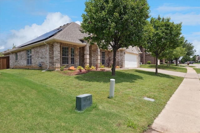 10237 Red Bluff Ln, Fort Worth, TX 76177 - view of front of house featuring solar panels, a front yard, an attached garage, and driveway