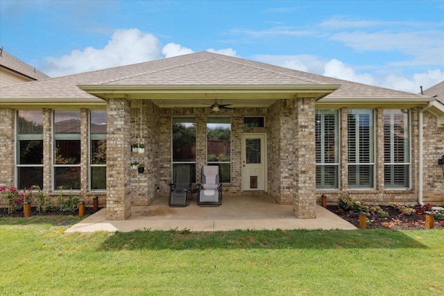 10237 Red Bluff Ln, Fort Worth, TX 76177 - back of property featuring a ceiling fan, a patio, a lawn, and brick siding