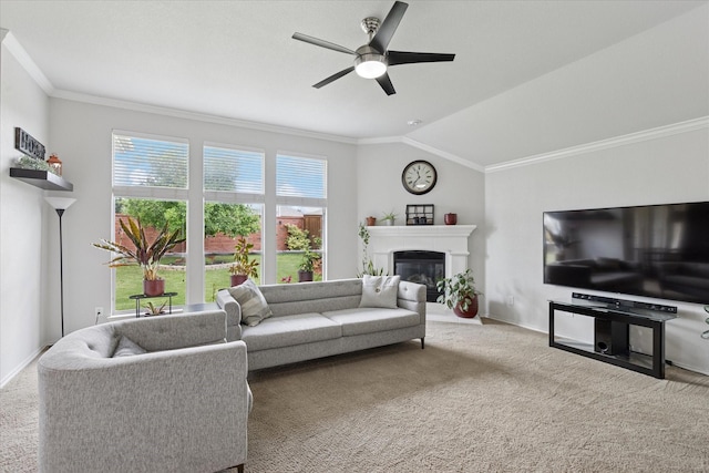 10237 Red Bluff Ln, Fort Worth, TX 76177 - carpeted living area featuring ceiling fan, a glass covered fireplace, baseboards, ornamental molding, and lofted ceiling