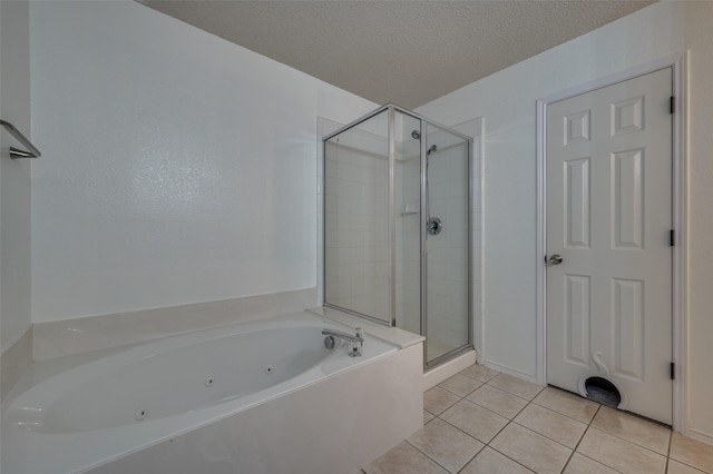 4178 Parterre Dr, Frisco, TX 75033 - full bathroom featuring a whirlpool tub, a shower stall, tile patterned floors, and a textured ceiling