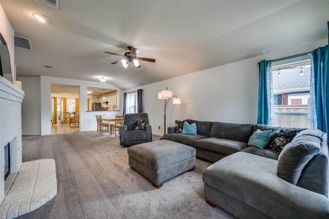 4178 Parterre Dr, Frisco, TX 75033 - living room with a ceiling fan, a brick fireplace, and carpet