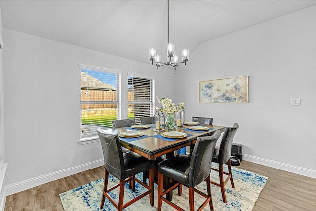 2512 Bunker Hill Dr, Burleson, TX 76028 - dining area featuring a chandelier, vaulted ceiling, baseboards, and wood finished floors