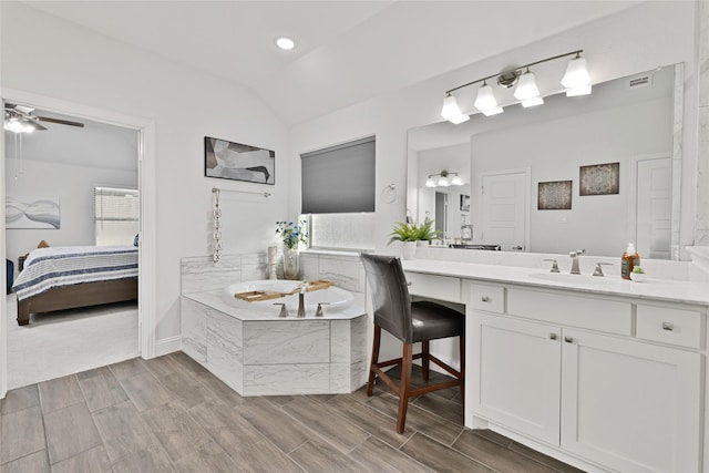 2512 Bunker Hill Dr, Burleson, TX 76028 - ensuite bathroom with vanity, a bath, vaulted ceiling, wood finished floors, and a ceiling fan