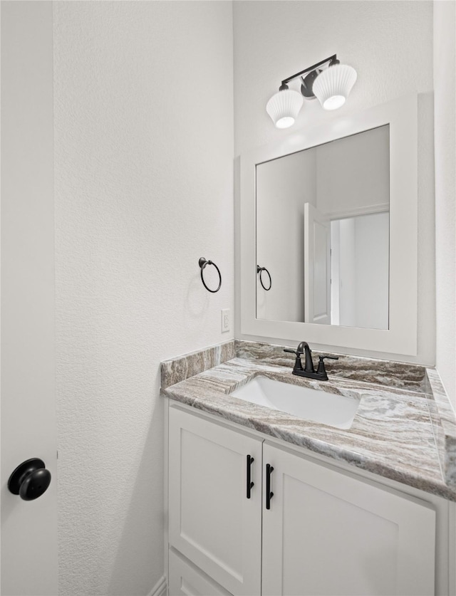 7009 Ranch View Pl, Springtown, TX 76082 - bathroom with vanity and a textured wall