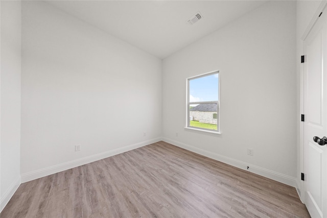 7009 Ranch View Pl, Springtown, TX 76082 - spare room with vaulted ceiling, light wood-style flooring, and baseboards