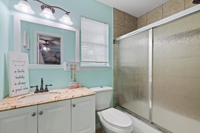 427 Paddy St, Mesquite, TX 75149 - bathroom featuring toilet, vanity, ceiling fan, and shower / bath combination with glass door