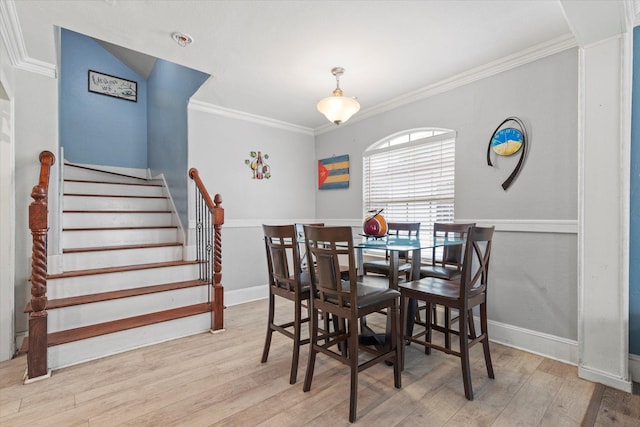 427 Paddy St, Mesquite, TX 75149 - dining room featuring wood finished floors, ornamental molding, stairway, and baseboards