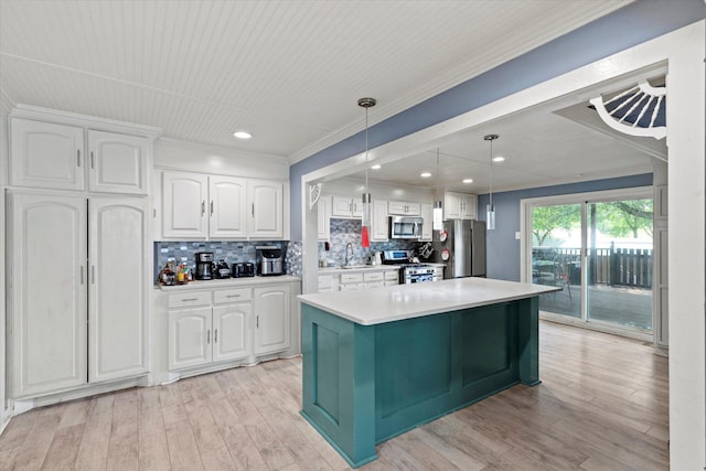 427 Paddy St, Mesquite, TX 75149 - kitchen with stainless steel appliances, white cabinets, light countertops, tasteful backsplash, and crown molding