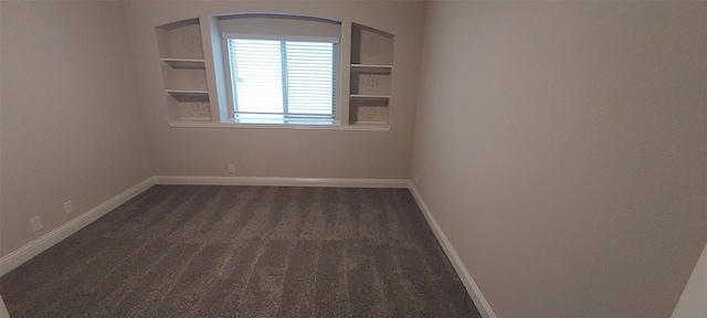 1094 Canterbury Ln, Forney, TX 75126 - spare room with dark carpet and baseboards